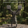 Snirr Precision X-1 Pro tactical slingshot front view placed on a tree stump in a lush green forest background